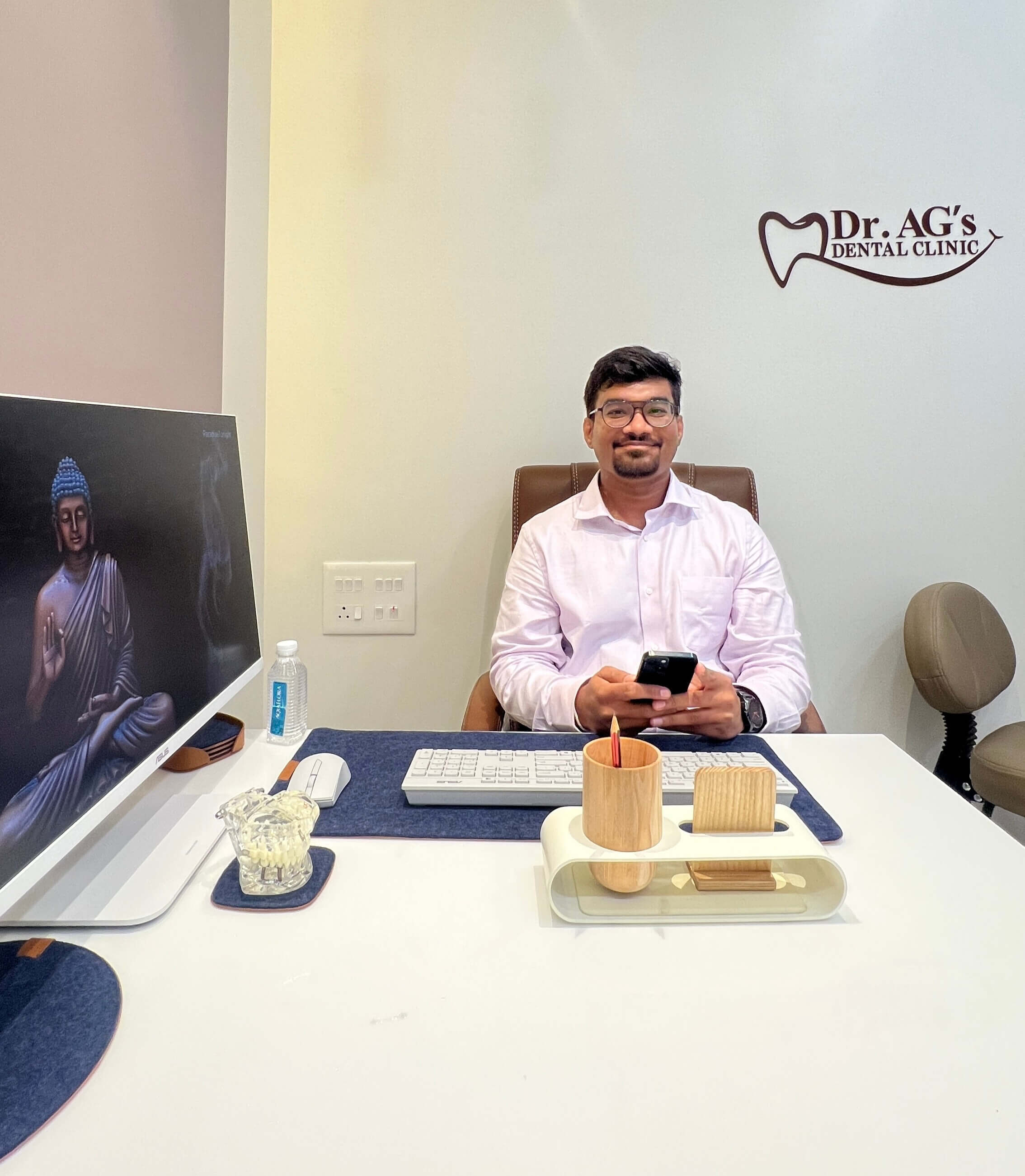 Dr. Arshdeep Ghodeswar, founder of Dr. AG's Dental Clinic, in his professional office